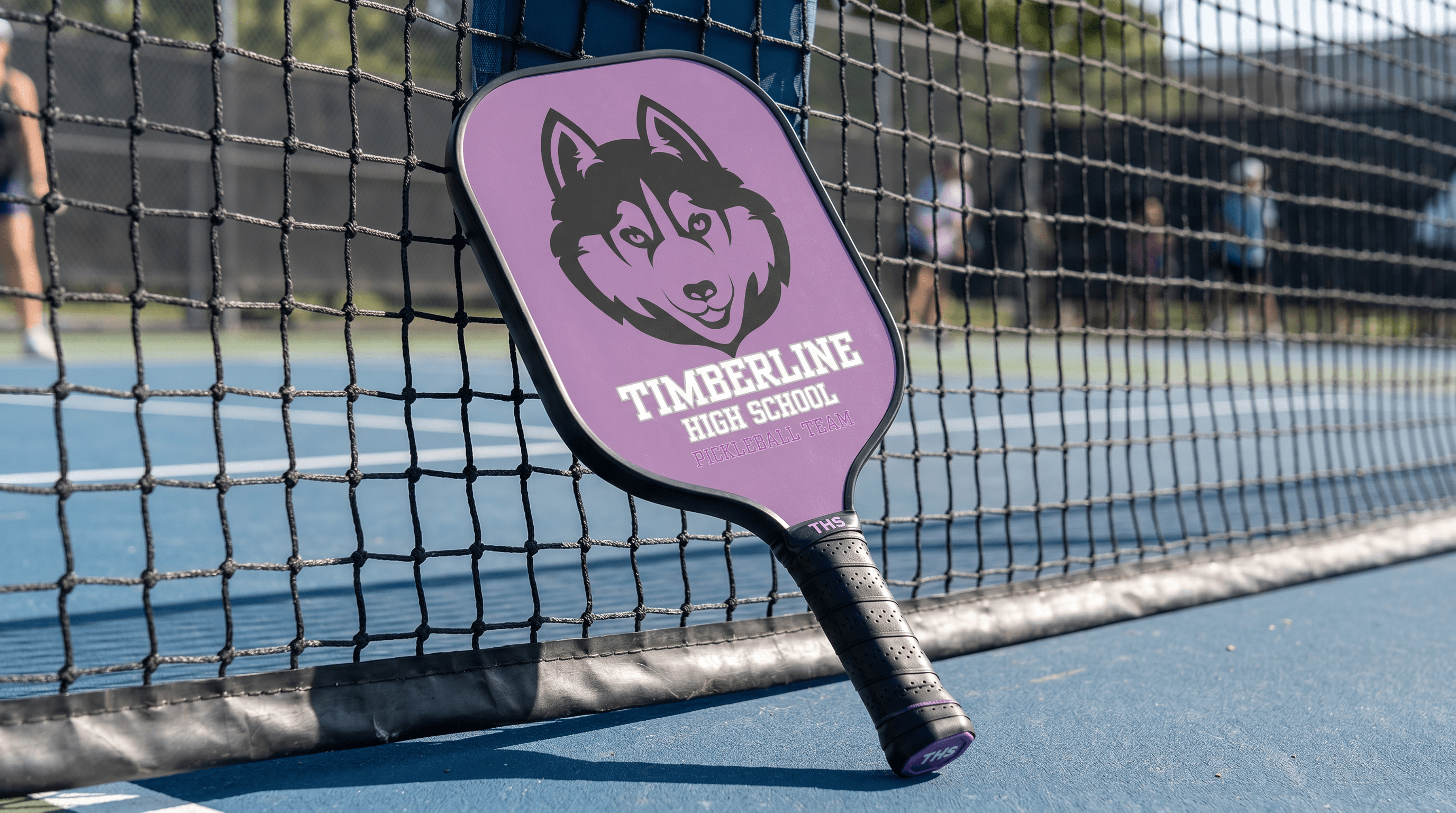 Timberline High School custom branded pickleball paddle on the court